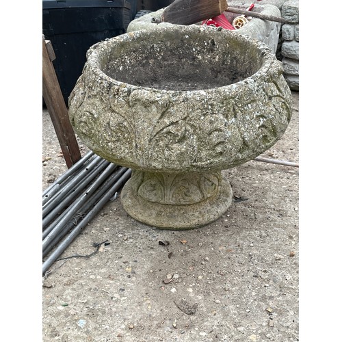 458 - A CONCRETE BOWL SHAPED PLANTER ON A SQUAT STAND