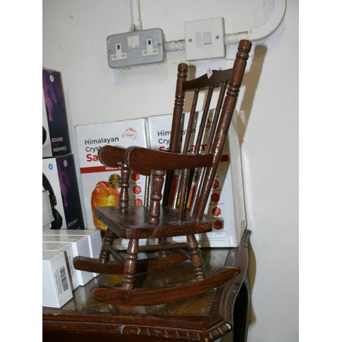 124 - A VINTAGE DOLLS ROCKING CHAIR