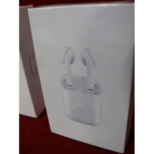 136 - 2 PAIR OF WIRELESS EAR BUDS IN WHITE ALONG WITH 2 PAIR OF WIRELESS EARPHONES ALL NEW AND PACKAGED.