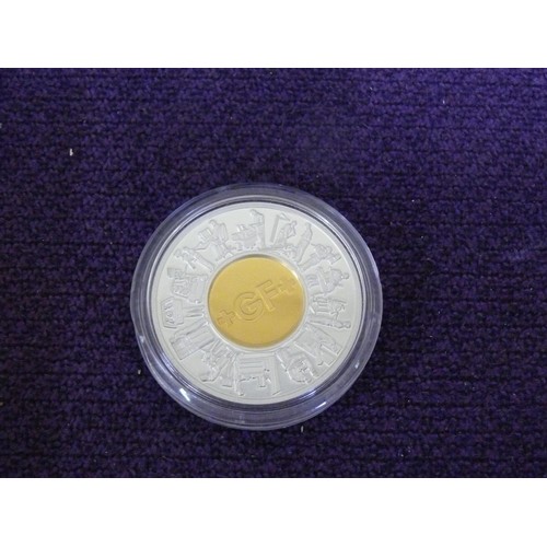 11 - A 14ct GOLD AND SILVER 2002 GEORGE FISCHER SOUVENIR MEDAL 14ct GOLD IS 5gr AND SILVER 31Gr