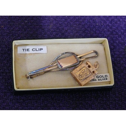 12 - A RETRO 9CT GOLD ON SILVER 1950`S TIE CLIP AND AND A CHARM