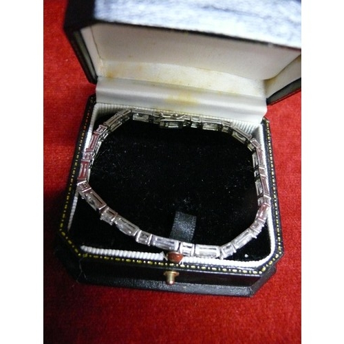 28 - A SOLID SILVER BRACELET WITH HAND CUT CRYSTAL STONES IN LOVELY GIFT BOX