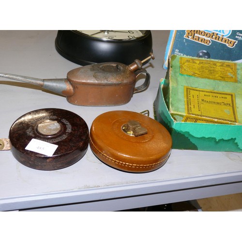 485 - CHESTERMAN BAKELITE TAPE MEASURE, A RABONE TAPE MEASURE IN LEATHER CASE, AND A VINTAGE OIL CAN