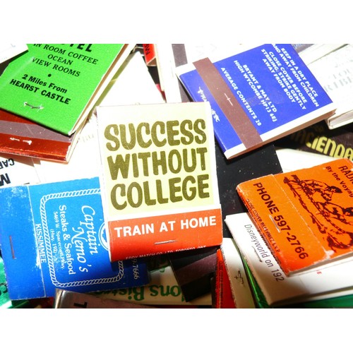 131 - TIN OF ADVERTISING BOOKS OF MATCHES,