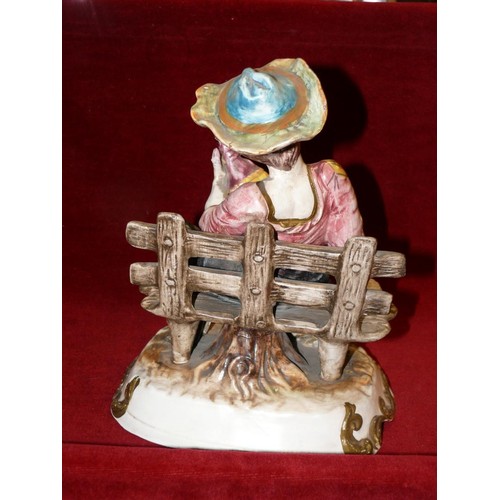 94 - LARGE CAPODIMONTE FIGURE ON A BENCH DRINKING FROM A DECANTER