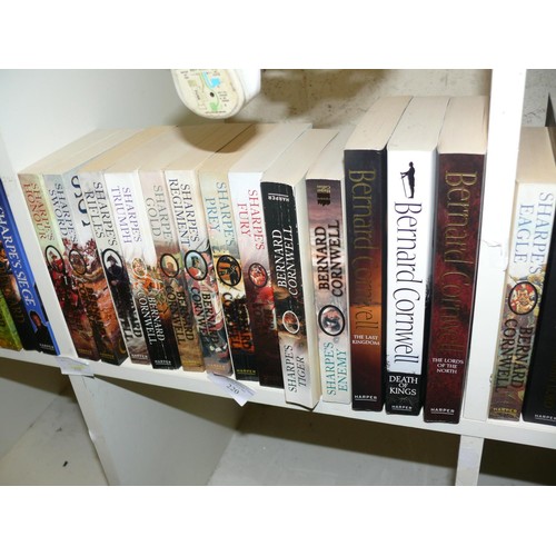 220 - A SET OF BOOKS BY BERNARD CORNWELL, MOSTLY PAPERBACKS