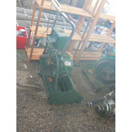 515 - A 24 INCH CUT VINTAGE PETROL MOWER IT DOES RUN BUT IS FOR SPARES OR REPAIR.