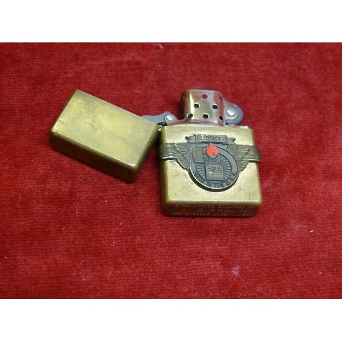 49 - Vintage Zippo lighter with solid brass case, Zippo emblem on the face and patent number on the foot.