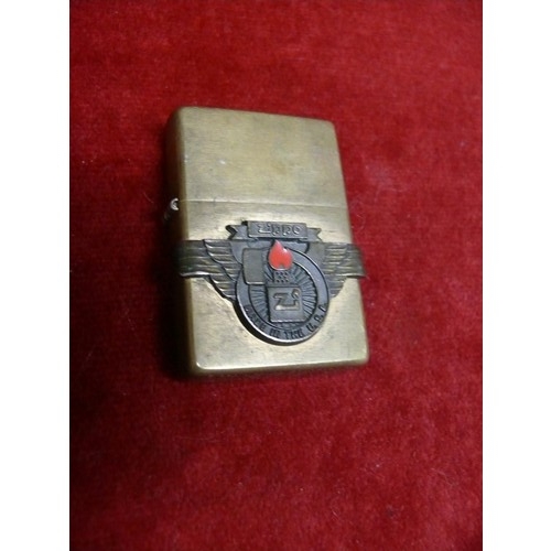 49 - Vintage Zippo lighter with solid brass case, Zippo emblem on the face and patent number on the foot.