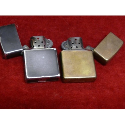 50 - A pair of Zippo lighters - 1x Zippo 07 solid brass and 1x Zippo XIII powder coated.