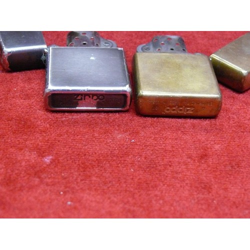 50 - A pair of Zippo lighters - 1x Zippo 07 solid brass and 1x Zippo XIII powder coated.