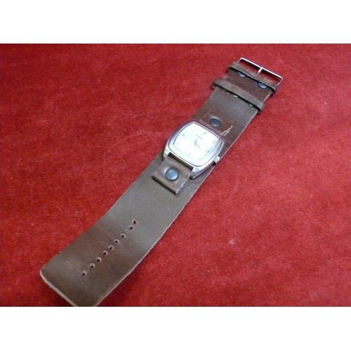 56 - Fossil wrist watch with wide leather strap.