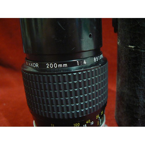 5 - A vintage Nikon Nikkor 200mm camera lens with protective case.