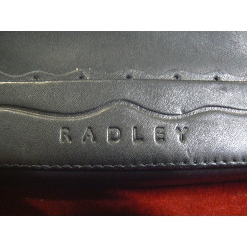 10 - Radley black leather mini clutch handbag with Scottie dog tag.