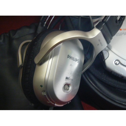 11 - Sony CD walkman with case, with Philips over ear headphones and yurbuds earphones.