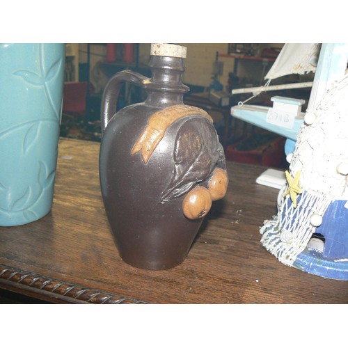 69 - MYSTIC TEAL DEBOSSED FLORAL VASE AND A TURGIS STONEWARE POTTERY APPLE BRANDY JUG WITH STOPPER