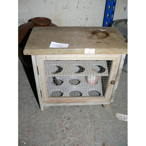 444 - A WOODEN EGG CUPBOARD WITH MESH FRONT