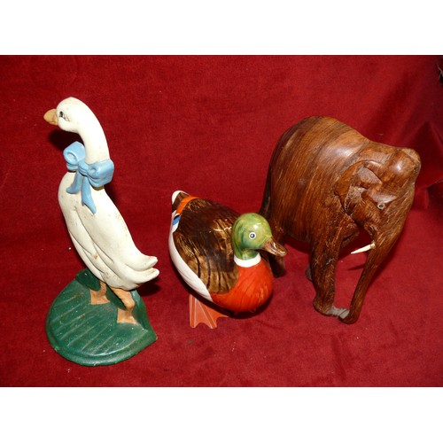 72 - A CARVED WOODEN ELEPHANT WITH BOTH HIS TUSKS! PLUS A CAST IRON GOOSE DOOR STOP AND A CERAMIC DUCK