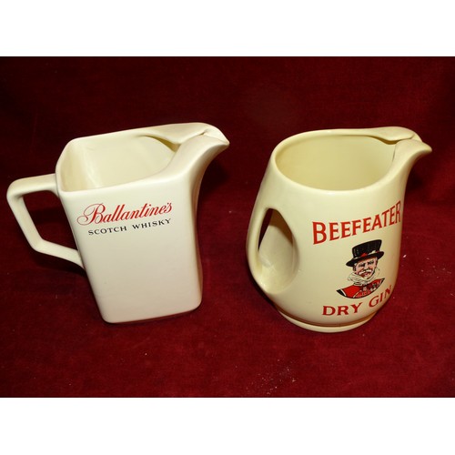 89 - A BALLANTINES SCOTCH WHISKY WATER JUG AND A BEEFEATER DRY GIN WATER JUG