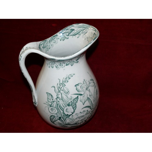 142 - A PORTMEIRION BOTANIC GARDEN JUG PLUS A LARGE TRANSFERWARE JUG