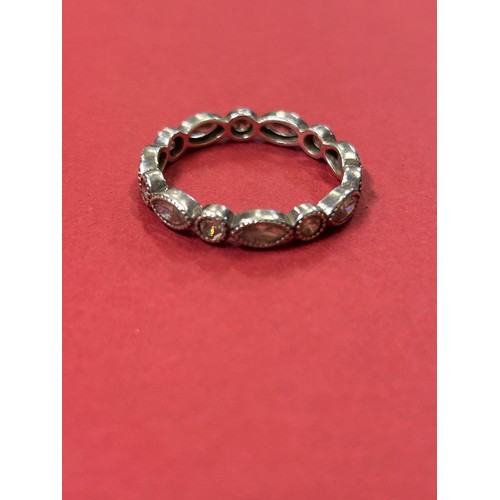 35 - 925 SILVER ETERNITY RING SET WITH ALTERNATE MARQUISE AND ROUND CLEAR STONES. SIZE O/P