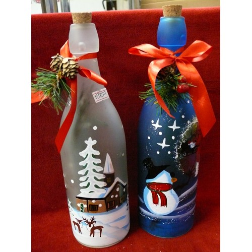 102 - 2 X 29CM LIT CHRISTMAS DECORATION BOTTLES 1 WITH HOUSE DECORATION AND 1 WITH SNOWMAN DECORATION