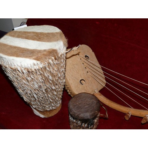 172 - 3 AFRICAN HIDE INSTRUMENTS 2 DRUMS AND AN ARCHED HARP