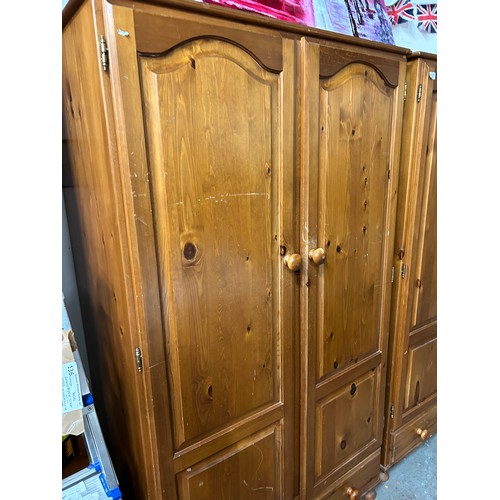 410 - ANOTHER PINE DOUBLE WARDROBE WITH PANELLED DOORS AND DRAWER BELOW