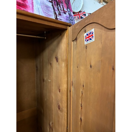 410 - ANOTHER PINE DOUBLE WARDROBE WITH PANELLED DOORS AND DRAWER BELOW