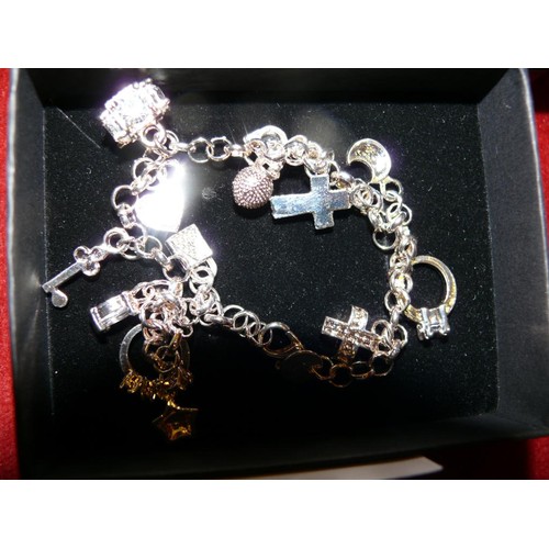 29 - 2 BOXES OF SILVER CHARM BRACELETS WITH 12 CHARMS ON EACH