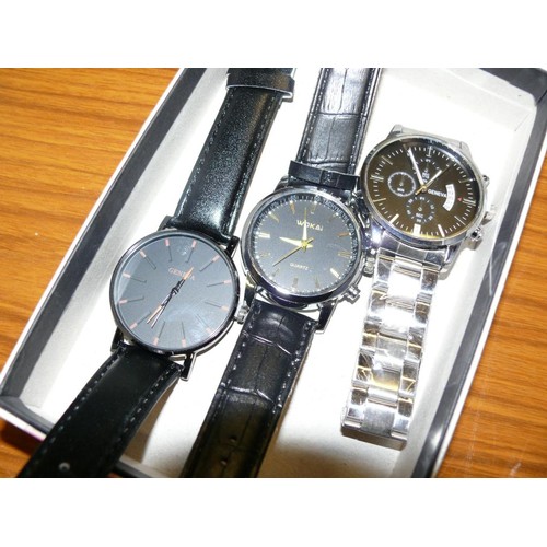 25 - A BOX WITH 3 WATCHES 2 WITH BLACK STRAPS AND 1 WITH S/STEEL STRAP