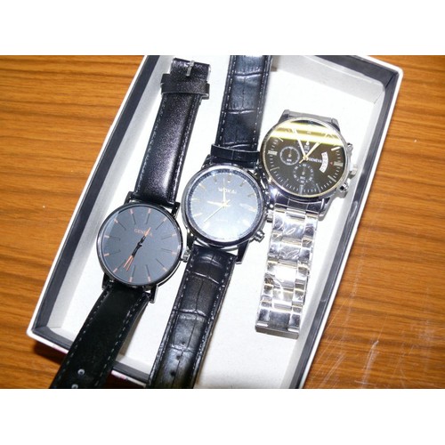 25 - A BOX WITH 3 WATCHES 2 WITH BLACK STRAPS AND 1 WITH S/STEEL STRAP