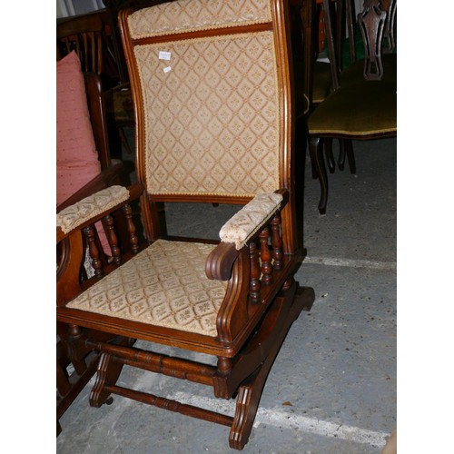 432 - Early 20thC oak American rocker chair with turned spindles and stretchers. Woven floral ivory colore... 