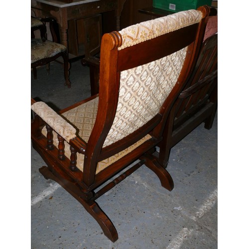 432 - Early 20thC oak American rocker chair with turned spindles and stretchers. Woven floral ivory colore... 