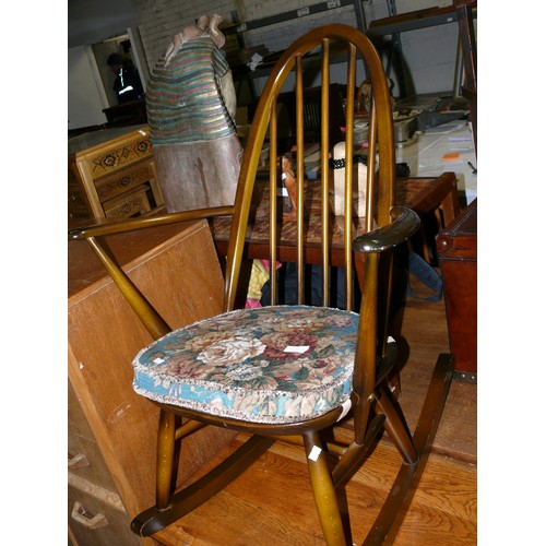 444 - Ercol 428 stick back rocking chair (1979), with the original Ercol popper button floral seat pad.