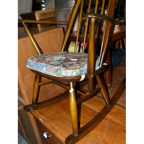 444 - Ercol 428 stick back rocking chair (1979), with the original Ercol popper button floral seat pad.