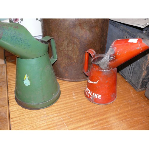 308 - A Havoline motor oil advertising quart pourer jug, a green half gallon pourer jug and a large vintag... 