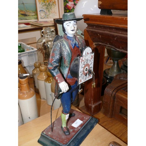 317 - Vintage J.V.E Holland peddlar mantle clock. A cast iron figure of a Dutch clock street seller/peddla... 