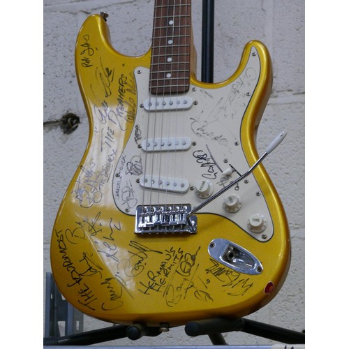 73 - SIGNED Aria STG-series gold flake Stratocaster electric guitar covered in musicians signatures front... 