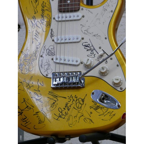 73 - SIGNED Aria STG-series gold flake Stratocaster electric guitar covered in musicians signatures front... 