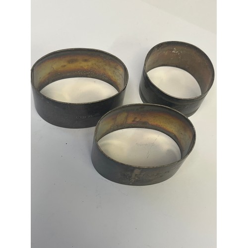 48 - THREE SOLID NAPKIN RINGS 2 OVALS AND A ROUND, 3.22TOZ.