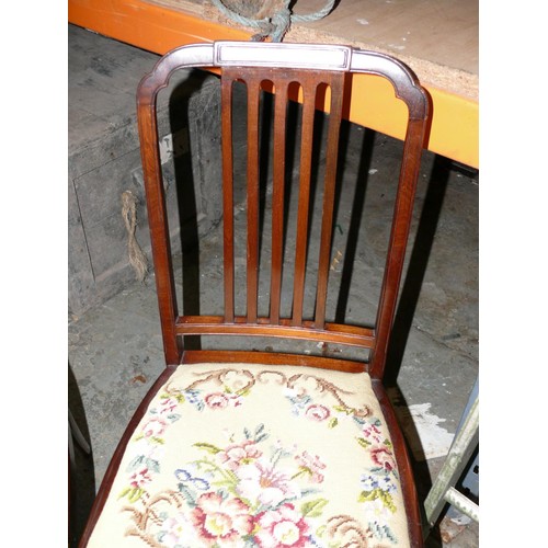 422 - A pair of Victorian mahogany dining chairs, with drop in needlepoint seats.