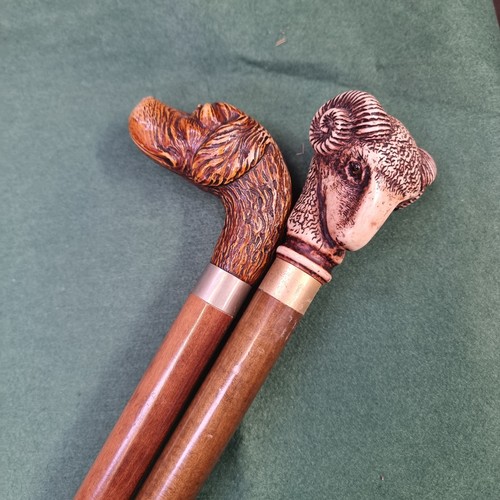 329 - 2x Vintage walking sticks with resin animal figure heads and brass collar ferrules, 1x Ram and 1x hu... 