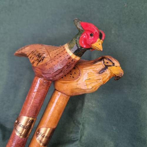 330 - 2x wooden walking sticks with hand carved & painted bird handles. 1x Pheasant & 1x Hawk. Each has a ... 