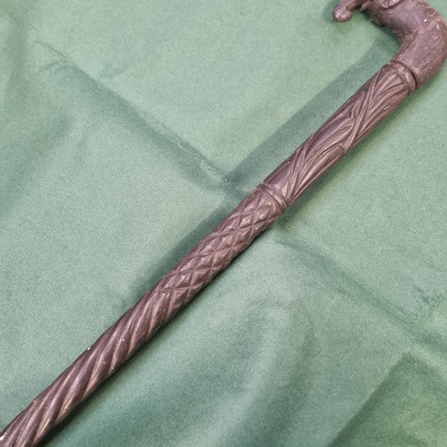 335A - African ebonised walking stick with carved elephants head handle.