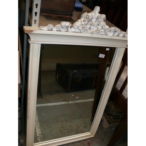 413 - A large over mantel mirror with classical scrolling ribbon cornice. Painted white.