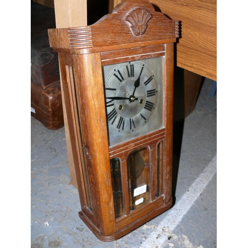 313B - Early 20thC glazed oak case mechanical wall clock with pendulum and winding key.