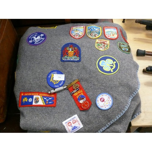 336 - Girl guides felt poncho blanket covered in 1980's guide patches, including a Trefoil Guild ribbon dr... 