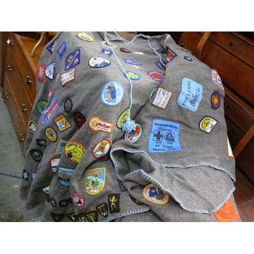 336 - Girl guides felt poncho blanket covered in 1980's guide patches, including a Trefoil Guild ribbon dr... 