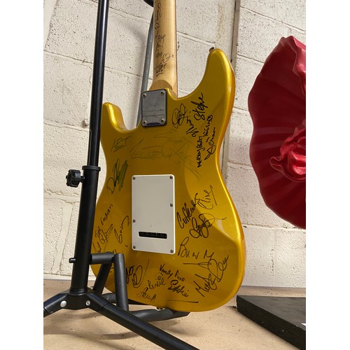 73 - SIGNED Aria STG-series gold flake Stratocaster electric guitar covered in musicians signatures front... 